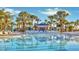 Relaxing resort-style pool with a swim-up bar and lounge chairs at 2210 Lelani Cir, Davenport, FL 33897