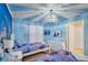 Frozen themed bedroom with two twin beds and a flat screen TV at 2210 Lelani Cir, Davenport, FL 33897