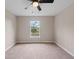 Spacious bedroom with carpeted floors and a large window at 18645 Seaview St, Orlando, FL 32833
