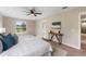 Spacious bedroom with a king-size bed, ensuite bathroom access, and large window at 18645 Seaview St, Orlando, FL 32833