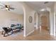 Light-filled hallway with arched doorways and wood-look floors at 18645 Seaview St, Orlando, FL 32833