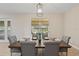 Dining room with a wooden table, gray chairs, and a view of the backyard at 18645 Seaview St, Orlando, FL 32833
