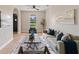 Bright living room featuring a comfy sofa, stylish rug, and large window at 18645 Seaview St, Orlando, FL 32833