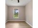 Spacious bedroom with large window and ceiling fan at 18645 Seaview St, Orlando, FL 32833