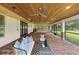 Relaxing screened patio with brick pavers, outdoor seating, and ceiling fan at 18645 Seaview St, Orlando, FL 32833