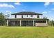 Two-story house with large backyard and screened patio at 18645 Seaview St, Orlando, FL 32833