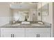 Double vanity bathroom with granite countertop and modern fixtures at 18645 Seaview St, Orlando, FL 32833