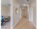 Light-filled hallway with arched doorways and wood-look floors at 18645 Seaview St, Orlando, FL 32833
