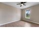 Spacious bedroom with large window and ceiling fan at 18645 Seaview St, Orlando, FL 32833