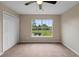Bedroom with window, carpet, and double door closet at 18645 Seaview St, Orlando, FL 32833