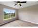 Well-lit bedroom with large window and carpet at 18645 Seaview St, Orlando, FL 32833