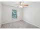 Well-lit bedroom with ceiling fan and window at 2210 India Blvd, Deltona, FL 32738