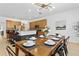 Bright dining area with a farmhouse table and chairs, perfect for Gathering meals at 290 Las Fuentes Dr, Kissimmee, FL 34746