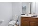 Clean and simple bathroom with wood vanity and a single sink at 290 Las Fuentes Dr, Kissimmee, FL 34746