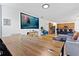 Open concept living space with a large screen and comfortable seating at 290 Las Fuentes Dr, Kissimmee, FL 34746