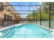 Large screened pool with a spacious patio area at 290 Las Fuentes Dr, Kissimmee, FL 34746