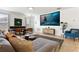 Home theater room with projector, screen, comfortable seating, and stylish decor at 290 Las Fuentes Dr, Kissimmee, FL 34746
