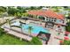 Relaxing community pool with plenty of lounge chairs and a spa at 290 Las Fuentes Dr, Kissimmee, FL 34746