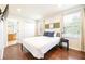 Bedroom with en-suite bathroom and wood floors at 290 Las Fuentes Dr, Kissimmee, FL 34746