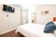 Comfortable bedroom with TV and en-suite bathroom at 290 Las Fuentes Dr, Kissimmee, FL 34746