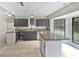 Kitchen features granite countertops, an island, and dark gray cabinets at 862 N 4Th Ave, Deltona, FL 32725