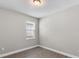 Bright bedroom with large window and neutral walls at 2141 Divot Drive Dr, Daytona Beach, FL 32124
