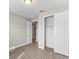 Bright bedroom with neutral walls and a walk-in closet at 2141 Divot Drive Dr, Daytona Beach, FL 32124