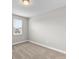Bright bedroom with window and neutral decor at 2141 Divot Drive Dr, Daytona Beach, FL 32124