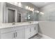 Modern bathroom featuring double vanity and marble shower surround at 2141 Divot Drive Dr, Daytona Beach, FL 32124