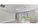 Open living room with sliding glass doors leading to backyard at 2141 Divot Drive Dr, Daytona Beach, FL 32124