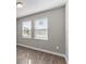 Simple bedroom with gray walls and wood-look flooring at 2141 Divot Drive Dr, Daytona Beach, FL 32124