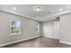 Bright bedroom with two windows and wood-look flooring at 2141 Divot Drive Dr, Daytona Beach, FL 32124