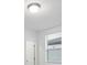 Bedroom with window, blinds, and white door at 3182 Viceroy Ct, Poinciana, FL 34759