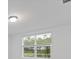 Window showing view of trees and pond at 3182 Viceroy Ct, Poinciana, FL 34759