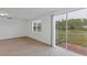 Bright living room with sliding glass doors to patio at 3182 Viceroy Ct, Poinciana, FL 34759