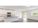 Modern kitchen with island, stainless steel appliances, and view at 3174 Viceroy Ct, Poinciana, FL 34759