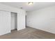 Bedroom with carpet flooring, a double-door closet, and an additional door at 3174 Viceroy Ct, Poinciana, FL 34759