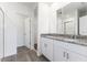 Bathroom boasts double vanity with granite countertop at 3174 Viceroy Ct, Poinciana, FL 34759