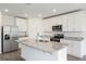 Modern kitchen with stainless steel appliances and granite island at 3174 Viceroy Ct, Poinciana, FL 34759
