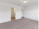 Spacious bedroom with carpet, en-suite bathroom access, and a walk-in closet at 3174 Viceroy Ct, Poinciana, FL 34759