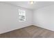 Bright bedroom with neutral-toned carpet and large window at 3174 Viceroy Ct, Poinciana, FL 34759