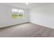 Bright bedroom with carpeting, large window, and view at 3174 Viceroy Ct, Poinciana, FL 34759
