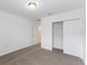 Bedroom with carpet flooring and a sliding closet door at 3174 Viceroy Ct, Poinciana, FL 34759