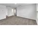 Spacious bedroom with gray carpeting and multiple doorways at 3793 Bluethread Way, Poinciana, FL 34759