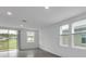 Open living space with tile floors and large windows at 3793 Bluethread Way, Poinciana, FL 34759