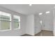 Bright and airy entryway with wood-look floors and neutral walls at 3793 Bluethread Way, Poinciana, FL 34759