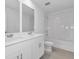 Double vanity bathroom with tub and tile flooring at 3793 Bluethread Way, Poinciana, FL 34759