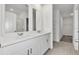 Bright bathroom boasts double sinks, a walk-in shower, and a large closet at 3793 Bluethread Way, Poinciana, FL 34759