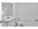 Simple bathroom with pedestal sink and toilet at 3793 Bluethread Way, Poinciana, FL 34759