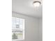 Simple bedroom with window and door to adjacent room at 3166 Viceroy Ct, Poinciana, FL 34759